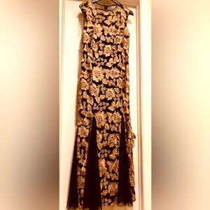 Size 12 long black and gold lace gown. Like new condition